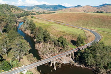 Thunderbolts Way crosses the Barnard River on a one-lane bridge north of Gloucester, NSW, Australia.