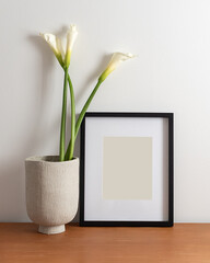 Black Picture Frame with Matting on a Desk with a Vase and Flowers, White Background. Poster and Print Design Photo Mock-Up, Blank and Empty Frame, Minimal - 12x16 inches, 8x10 inches or Similar Ratio