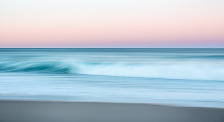 Waves breaking on the beach at sunset