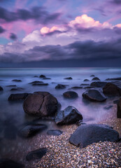 Sunset over the sea on a rocky shore line at Burleigh Heads