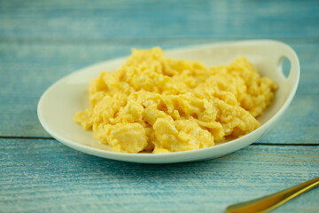 Scrambled eggs in a small dish