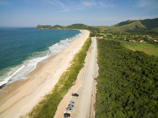 Deserted beach. Beautiful sunny coast view. Jaconé beach, Rio de Janeiro state, Brazil.