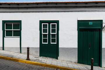 Traditional colonial house with guillotine windows and green Door. North of El Hierro Island. Canary Islands. Spain.