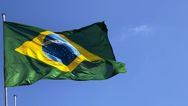 Brazil's flag. Brazilian flag blowing in the wind. Slow-motion footage.