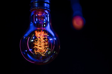 Close up of a glowing lamp in the dark copy space.