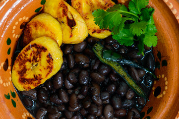 Traditional Mexican and Central American breakfast. Black beans and plantain