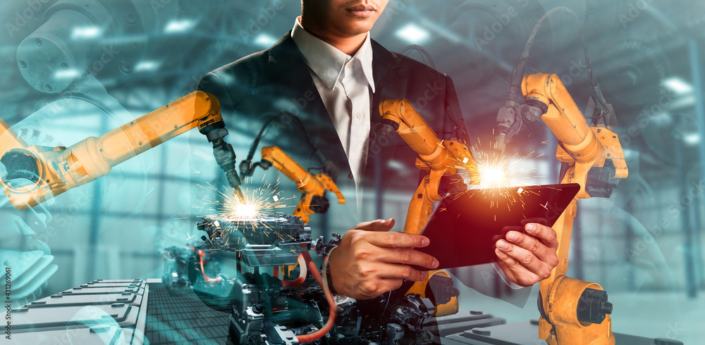 Poster mechanized industry robot arm and factory worker double exposure . concept of robotics technology fo