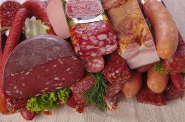 Meat products, ham and smoked meats, dill and parsley. 