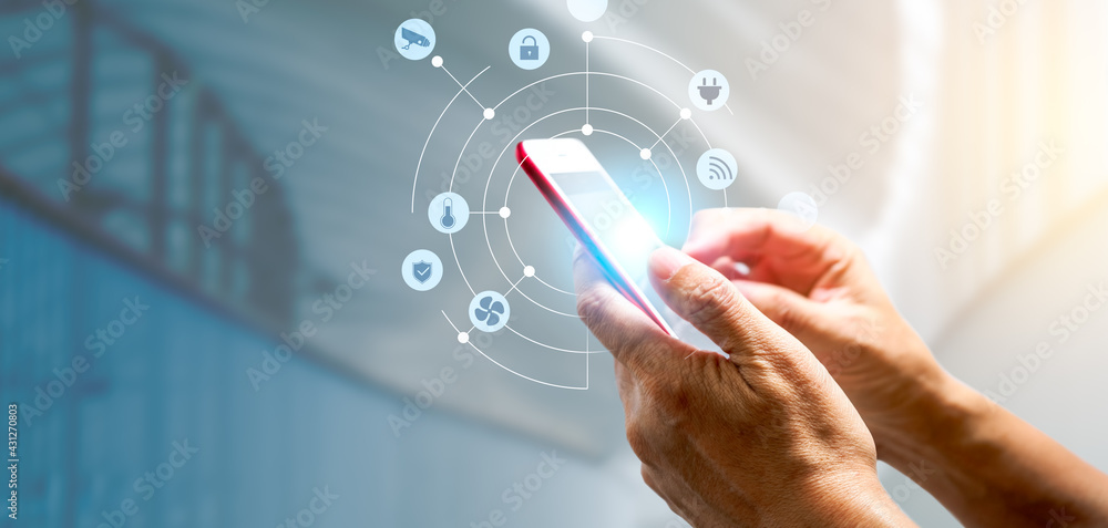 Aufkleber man's hand using a smartphone controlling smart home automation assistant. smart home concept