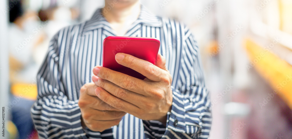 Poster man's hand using smartphone online with blurred background. networking technology and social media c