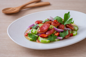 Spicy chinese pork sausage salad on plate, Thai food