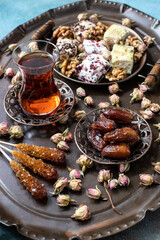 Still life with  eastern sweets and  tea in glass cup