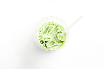 Matcha Japanese green tea with ice in glass on white table. View from above.