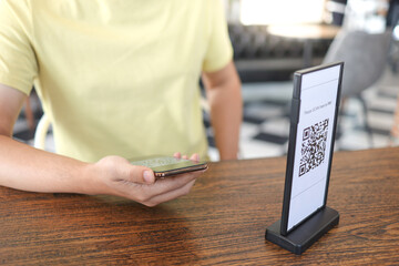 Qr code payment. E wallet. Man scanning tag accepted generate digital pay without money.scanning QR code online shopping cashless payment and verification.technology concept