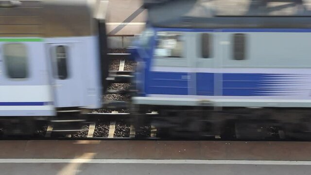 Passenger train going between platforms
