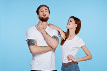 Fototapeta premium young couple in white t-shirt fashion modern style blue background