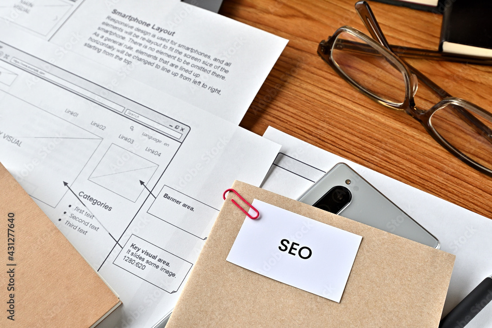 Poster there is card with the word seo on it with dummy paper of design of web systems.