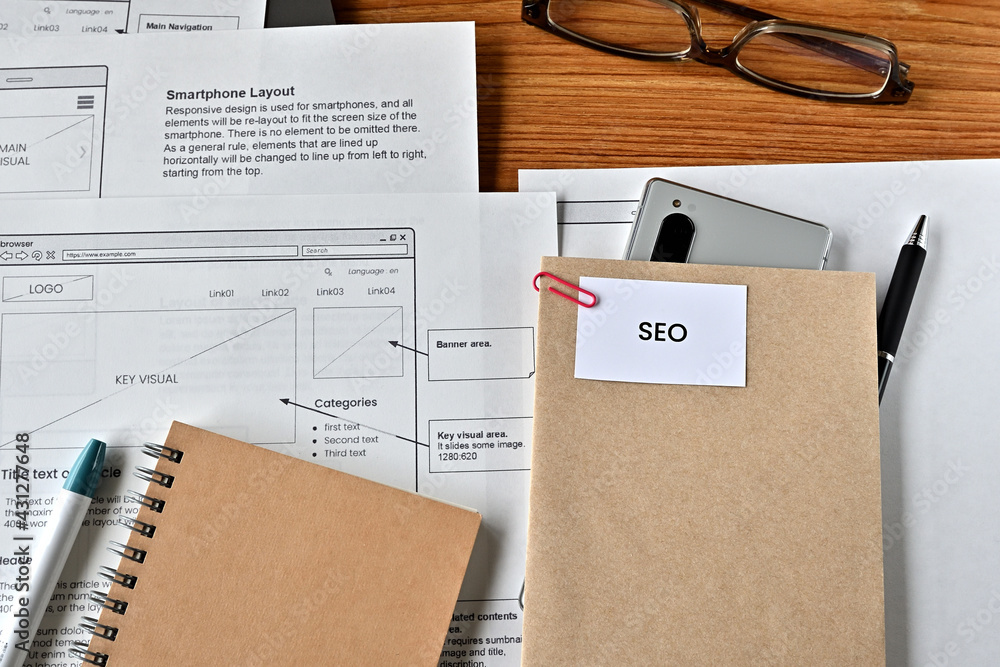 Poster there is card with the word seo on it with dummy paper of design of web systems.