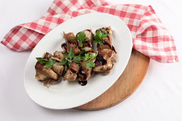Stewed pork ribs, home cooking, close-up, isolated on white background.