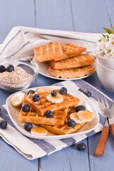 Waffles with blueberries, bananas and honey.