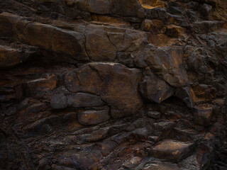 Orange stone rock, stone, textured. Background for design. Soft light.