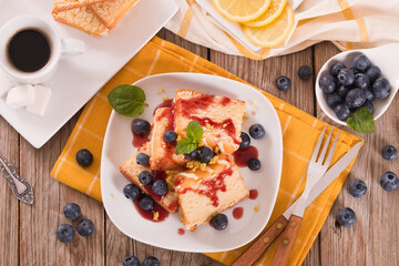 Lemon cake with blueberries and mint.