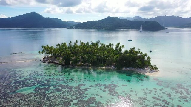Bora Bora in French Polynesia travel vacation paradise island. Aerial view of Motu Tapu paradise island and turquoise blue water in coral reef lagoon, Tahiti, South Pacific Ocean
