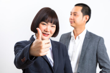 Happy business man and woman showing thumb up over white background.