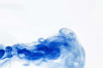 Puffs of paint in water. The dissolution of the dye in water. Water pollution. Concept art creativity.