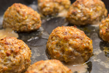 Homemade cutlets made of minced meat and vegetables, cooked in the oven. Selective focus. Close up.