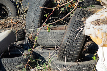 Waste illegally disposed of in nature and old used car tires