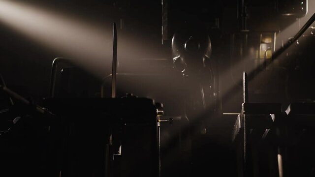 Old machinery, vintage letterpress studio, book production. Industrial scene, gears spinning in a workshop in slow motion. Historical machines, book making, artistic hobby.