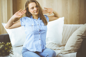 Tired upset woman worried about tiredness from domestic work and self isolation quarantine for COVID-19 Coronavirus. Mental health, anxiety depressed thinking young lady