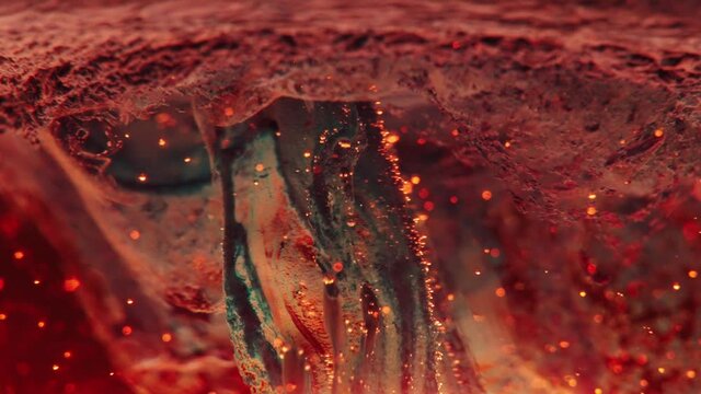 Strange mushroom forming in slow motion, hell concept. Magic particles, abstract red background in macro. Wallpaper, red motion graphics.