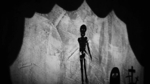 Vintage animation, shadow theatre on a wall. Pantomime, fantasy story. Halloween scene, black and white storytelling. Classic fable for children, creepy puppets.
