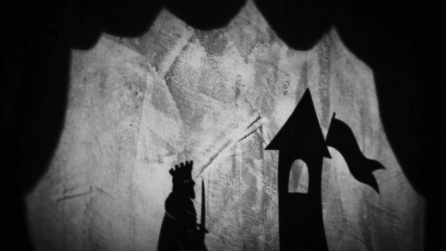 Vintage animation, shadow theatre on a wall. Pantomime, fantasy story. Halloween scene, black and white storytelling. Classic fable for children, creepy puppets.