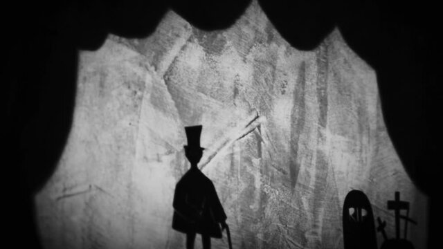 Vintage animation, shadow theatre on a wall. Pantomime, fantasy story. Halloween scene, black and white storytelling. Classic fable for children, creepy puppets.
