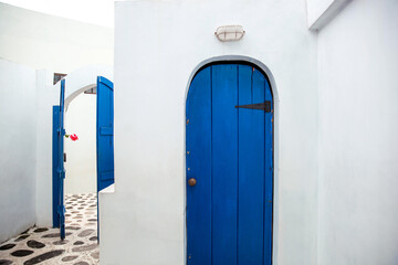 Old wooden blue door of Greece white traditional house Santorini