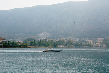 Beautiful view of a yacht on the water, Montenegro. Travel photo.