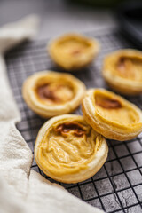 Portuguese sweet dessert pasteis pastel de nata on baking rack