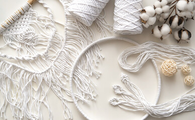 Flatlay with white threads and cords for macrame. Boho and eco concept