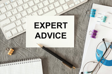 EXPERT ADVICE is written in a document on the office desk