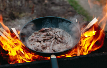 fire in the fireplace wok meat