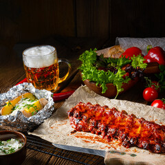 spicy spare ribs with baked potatoes and sour cream