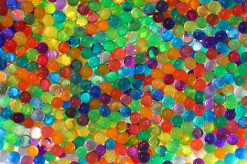 Abstract multicolored light background with hydrogel pearl texture