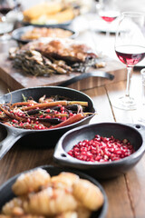 Roast meal on rustic country timber dinner table