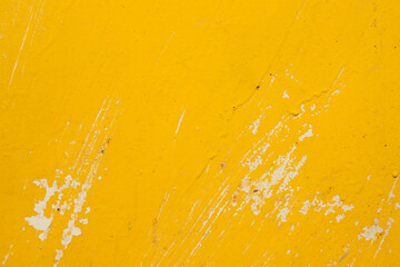 The texture of old paint on metal with scratches and roughness. Trendy yellow paint background.
