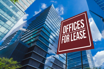 An offices for lease sign in front of a modern glassy commercial Grade A building. - obrazy, fototapety, plakaty