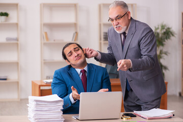 Two employees working in the office