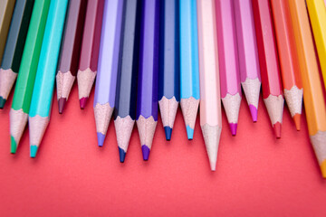 Colorful pencil set on red background